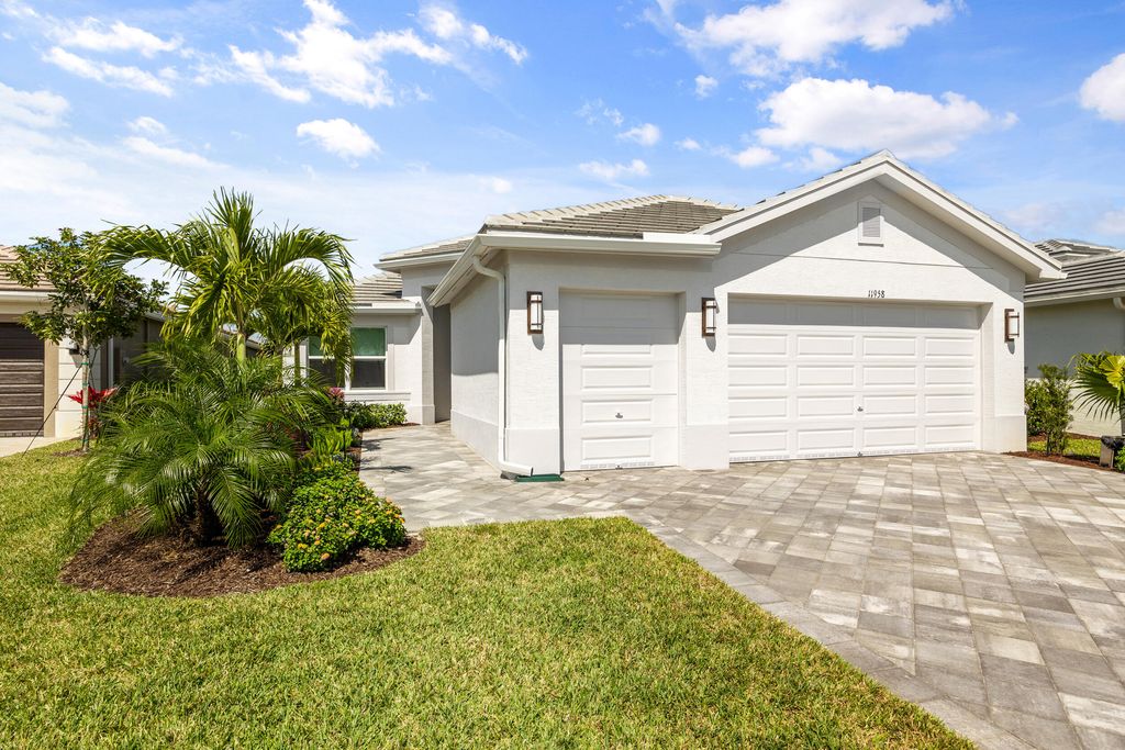 Photo of 11958 SW Coral Cove Parkway, Port Saint Lucie, FL 34987 (MLS # R10977079)