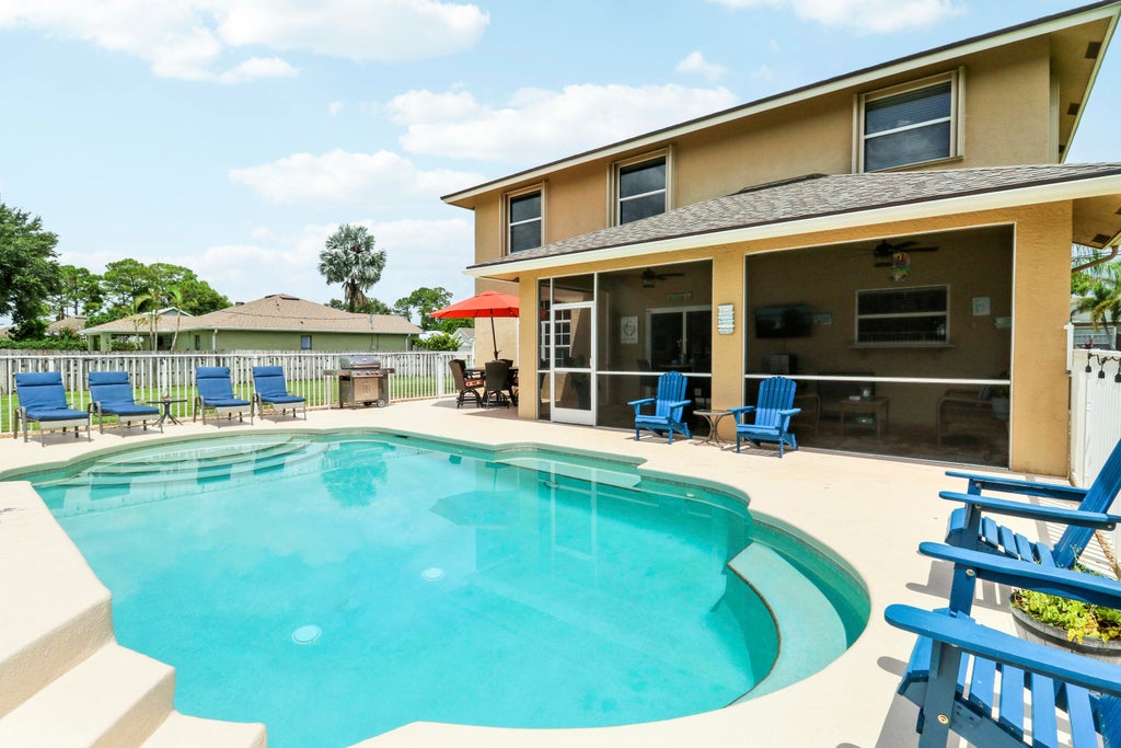 Photo of 1832 SW Grant Avenue, Port Saint Lucie, FL 34953 (MLS # B26066259)