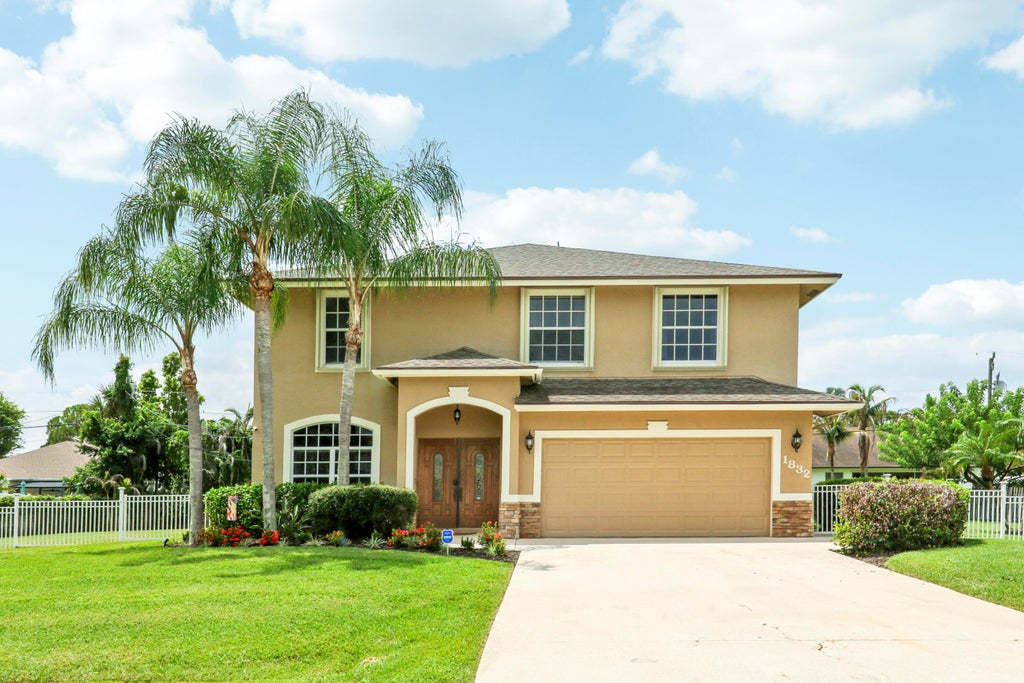 Photo of 1832 SW Grant Avenue, Port Saint Lucie, FL 34953 (MLS # B26066259)