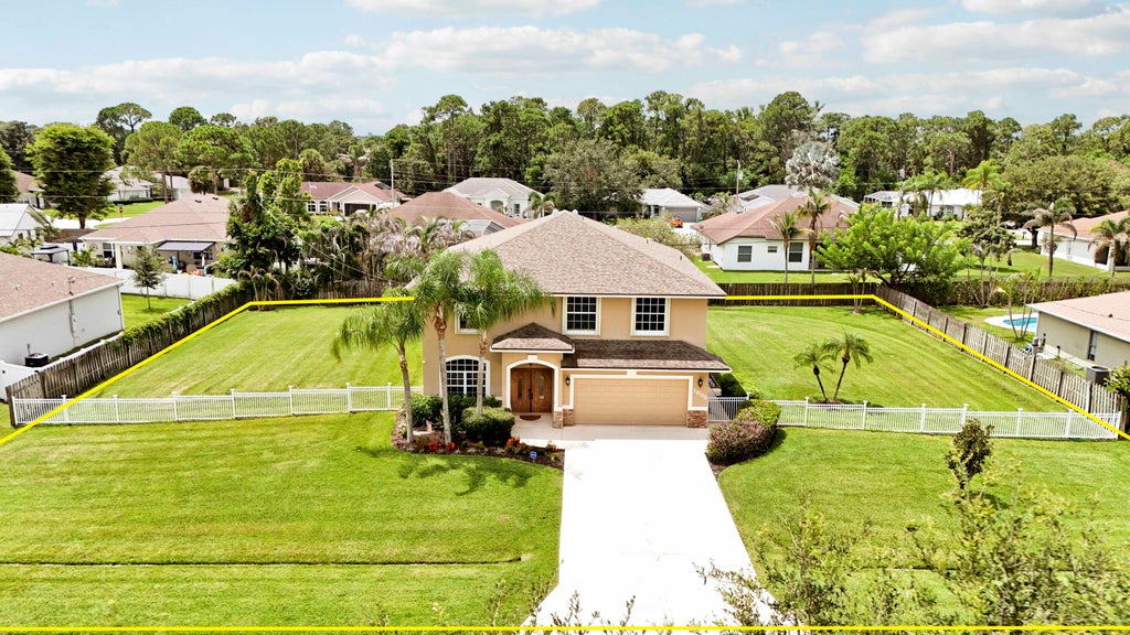 Photo of 1832 SW Grant Avenue, Port Saint Lucie, FL 34953 (MLS # B26066259)