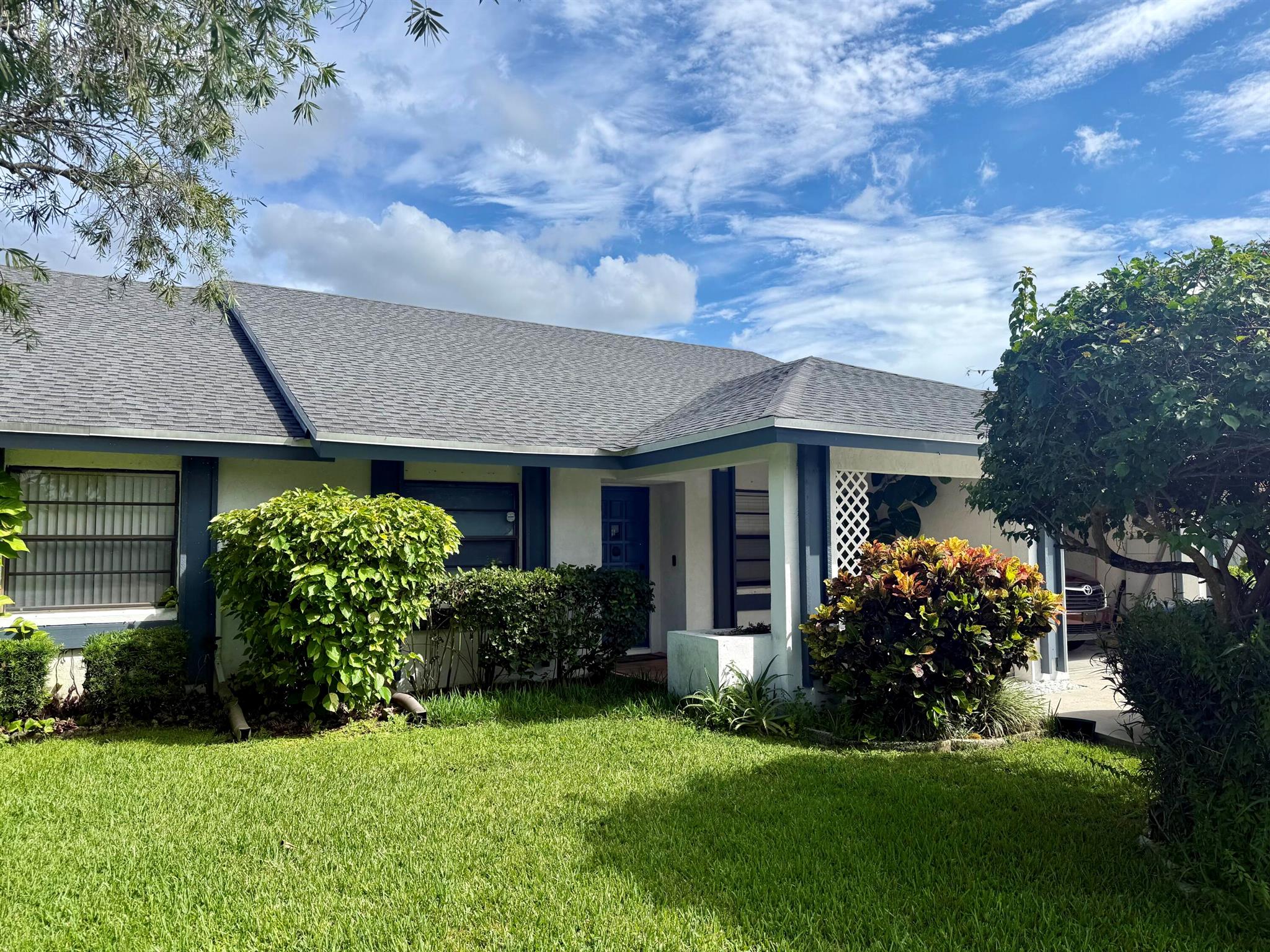 Welcome to this charming and move-in-ready townhome in the heart of Wellington, one of Palm Beach County's most sought-after communities! This well-maintained residence offers 2 bedrooms, 2 full bathrooms, a flexible den, and an attached garage, combining space, comfort, and privacy in a traditional layout. Recent upgrades include a brand new roof, newer kitchen appliances, A/C unit, and a new water heater--ensuring modern convenience and efficiency. The home features defined living, dining, and kitchen areas--ideal for those who prefer distinct spaces over an open floor plan. The den is perfect for a home office, guest room, or hobby space, and both bedrooms offer generous closets and natural light. Situated just minutes from shopping, dining, top-rated schools, parks, and downtown,