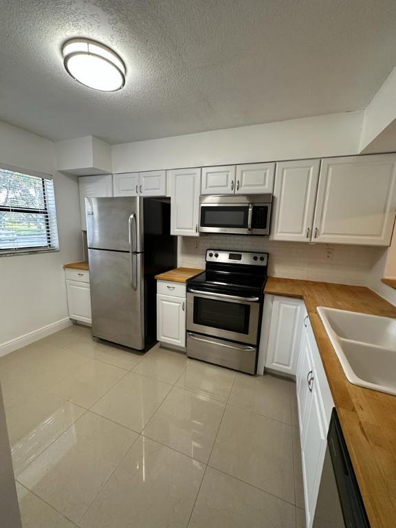 Photo of 3139 Millwood Ter #1240, Boca Raton, FL 33431 (MLS # R10954323)