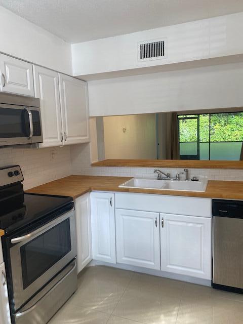 Photo of 3139 Millwood Ter #1240, Boca Raton, FL 33431 (MLS # R10954323)