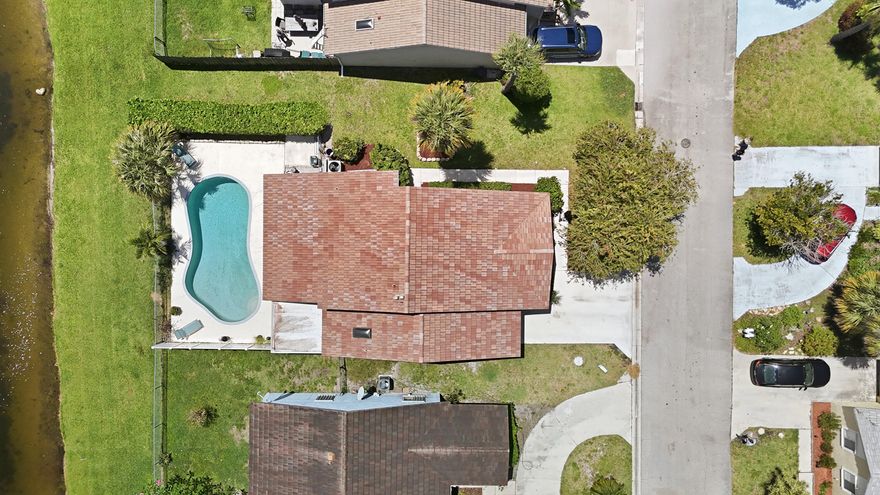 Beautifully updated lakefront pool home in desirable West Boynton Beach with wide water views and a covered patio for year-round outdoor living. Features 3 true bedrooms plus a flexible 4th bedroom/den with a window and doors (no built-in closet), ideal for office or guest space. High ceilings. Partial impact windows and sliders. Bright open layout captures natural light and lake views throughout. Located near Canyon Town Center, Cobblestone Commons, and Boynton Beach Marketplace featuring Whole Foods, plus Sprouts and Publix nearby. Zoned for West Boynton Middle School. Rare opportunity to own a lakefront pool home in a prime location—homes like this move quickly. Low HOA! Prime West Boynton Beach location offering convenience, accessibility, and strong lifestyle appeal. Ideally situated near Florida's Turnpike, Jog Road, and Boynton Beach Blvd for easy commuting throughout Palm Beach County.  Just minutes from Bethesda Hospital West and surrounding medical services.  Close to top west Boynton retail and dining including Canyon Town Center, Cobblestone Commons, Fountains Shopping Center, and Boynton Beach Marketplace with Whole Foods. Additional grocery options include Sprouts Farmers Market and Publix. Nearby fitness studios, restaurants, cafés, and everyday conveniences support a highly livable lifestyle.  Easy access east to Atlantic beaches, Delray Beach, and Boca Raton, and west to Wellington. Close to outdoor recreation including Green Cay Nature Center and Wetlands, Wakodahatchee Wetlands, and Arthur R. Marshall Loxahatchee National Wildlife Refuge. Nearby golf courses and parks further enhance the appeal.  Highly sought-after area for buyers searching lakefront pool homes in West Boynton Beach near shopping, Whole Foods, major highways, and beaches, offering long-term value and strong demand.