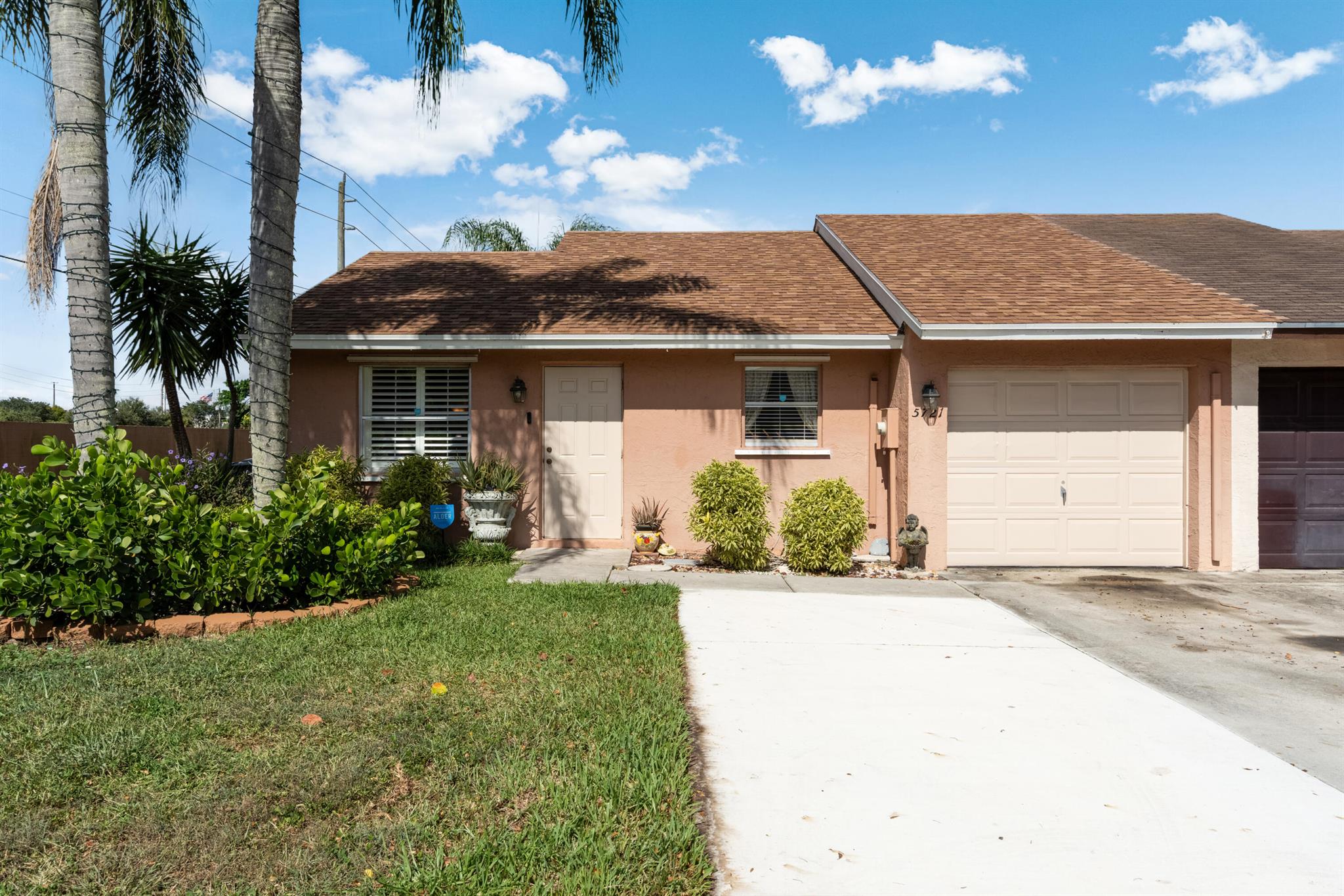 This charming end-unit townhome in the desirable Lee's Crossing community of Lake Worth. Offering 2 bedrooms, 2 bathrooms, and 1,124 sq. ft. of living space, this home is ideal for first-time buyers, empty nesters, or anyone seeking a low-maintenance lifestyle.Inside, you'll find a bright and welcoming layout with plantation shutters, a spacious screened patio, and a 2024 roof and generator hookup for peace of mind. The private, fenced backyard is perfect for relaxing, gardening, or entertaining guests. Beyond the home, you're just minutes from everything that makes Lake Worth special. Explore downtown's vibrant mix of restaurants, coffee shops, and boutique shopping, enjoy live performances at the Lake Worth Playhouse, or spend a day outdoors at some of the great parks.