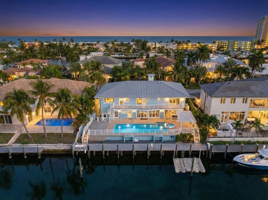 Exceptional 4BR/4BA waterfront estate in sought-after Lighthouse Point offers 90 feet of deep-water frontage just one canal from the Intracoastal & approx. 8 minute boat to Hillsboro Inlet. The home features a chef’s kitchen with Viking appliances and walk-in pantry. Home includes a large game room with wet bar and fireplace and a custom cedar storage closet. Major upgrades include a 2024 dock and seawall, full-house and dock power generator (2025), and new A/C systems (2025). The oversized, air-conditioned garage offers vaulted ceilings, custom-height doors, a dedicated storage room, and an exterior concrete storage closet. The pool deck is travertine with a pergola and retractable shade cover. Meticulously maintained and truly move-in ready in prime waterfront location.