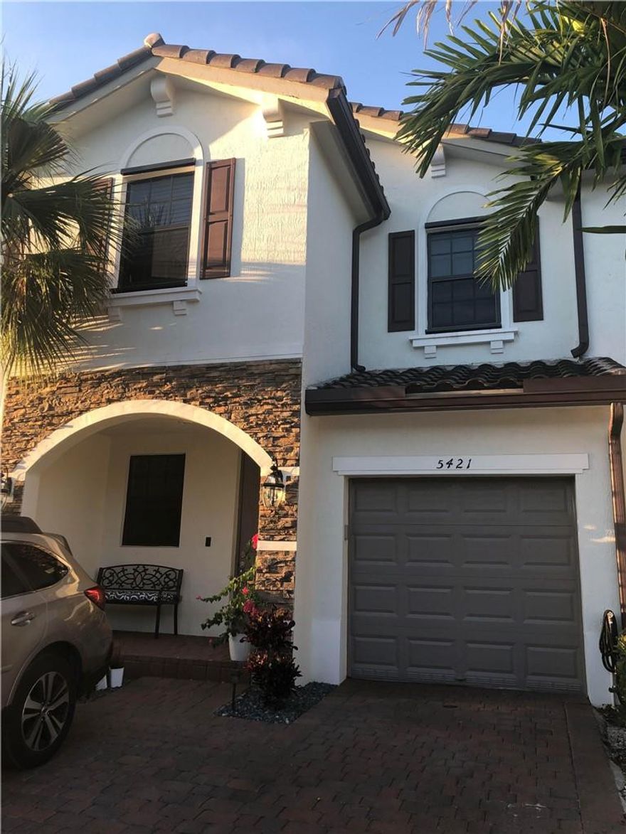 Modern, Smart Townhome, newly built in 2019 in family and pet friendly gated community. Technology includes Ring doorbell, thermostat, lighting, and door locks. Custom porcelain floors, chandelier and quartz counter tops. White cabinets in kitchen with Stainless Steel appliances. Washer and dryer on 2nd floor. View of lake from patio. Sidewalk and benches located around the lake so you can easily walk to the community pool. Hurricane shutters.