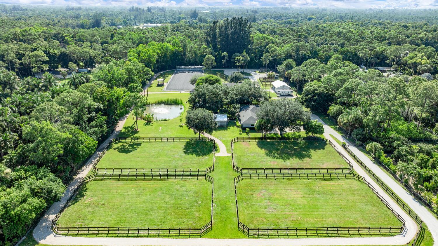 Incredible opportunity to own a piece of paradise! Discover your dream haven on this breathtaking meticulously maintained 5-acre equestrian estate! Property features a completely renovated 3 bed 2.1 bath stunning home, center-aisle CBS 8 stall barn with tongue and groove ceilings, a world-class riding arena with top level footing, and MORE! This property perfectly blends luxury living, serene peaceful privacy, and world-class equestrian training facilities just 8 miles from WEF and global competition show-grounds! Home Features:The stunning 3 Bedroom, 2.1 Bathroom home boasts impeccable design and functionality. The completely renovated interior features spacious bedrooms and bathrooms, immaculate finishes, and hurricane impact windows & doors throughout the entire home for added