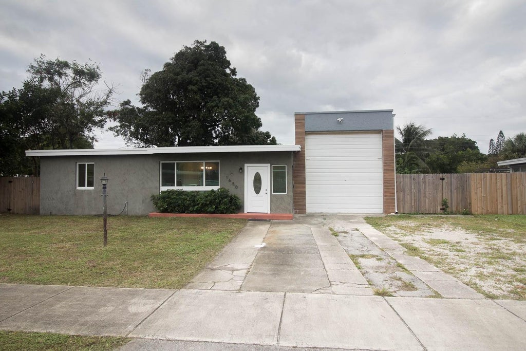 Photo of 1650 NE 44TH Street, Pompano Beach, FL 33064 (MLS # B26077031)