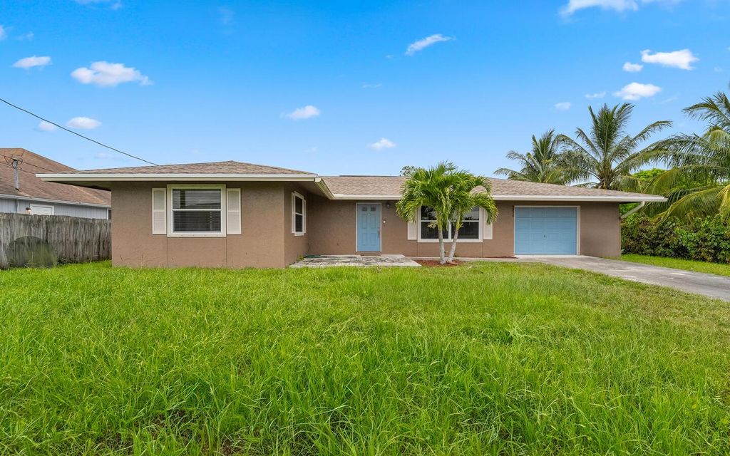 Photo of 2374 SW Woodridge Street, Port Saint Lucie, FL 34953 (MLS # R11004377)