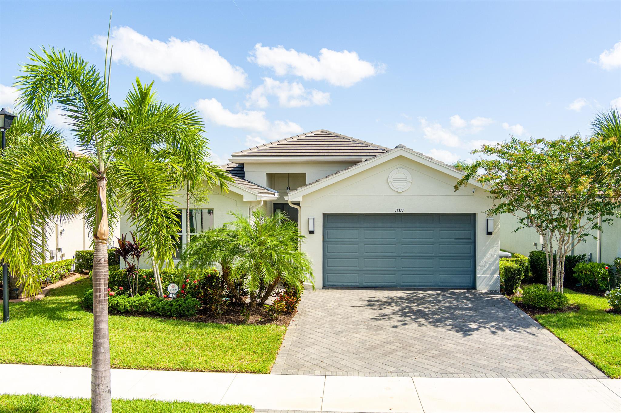 Best priced Lake front Heron Model home in Riverland, with loads of upgrades, and all tile throughout. Start Living the Valencia Lifestyle Today! Skip the 6-12 month wait for new construction and start enjoying the award-winning 55+ lifestyle at Valencia Cay in Riverland--Port St. Lucie's premier active adult community.This like-new 2021 Heron model offers 2 bedrooms, 2 baths, a den, and a private, tranquil lot with serene lake and garden views from the great room and primary suite. The open-concept design is filled with natural light and features such as complete impact glass windows, and doors for peace of mind. Interior Features include Spacious open floor plan with ceramic tile throughout the whole house. Gourmet kitchen with granite countertops, gas range, expanded pantry, stainless