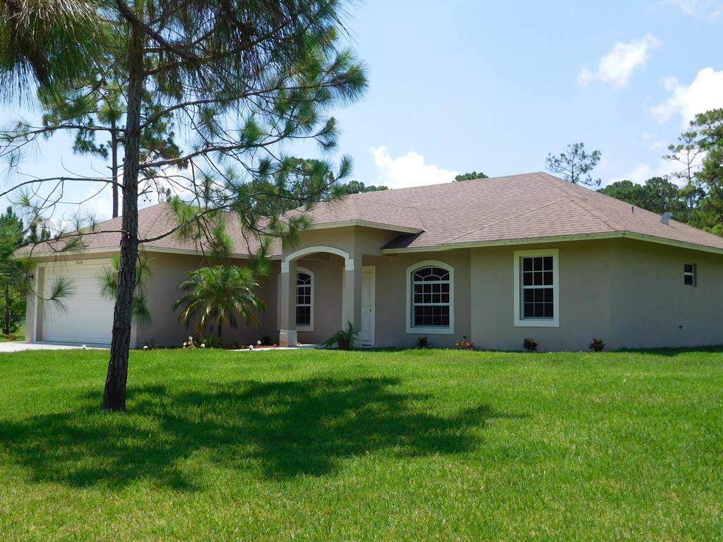 Impeccable, spacious and safety house.The covered entry leads into a bright open floor plan. Integrated living room, dining room, open kitchen snack counter and breakfast nook. High ceilings, arched doorways, recessed lights, ceiling fans, ceramic floors and light fixtures make this great room a cozy center of the family activities. Stainless steel appliances, granite counter tops. Ice maker refrigerator, under-mount sink, pool out faucet, wood cabinets make of this kitchen the perfect environment for a creative chef. Spacious master bedroom has walk-in closet and bathroom with dual sinks, roman bath tub, separate shower. IMPACT WINDOWS and SLIDING DOORS!. Located on a 1.25 acre lot, 2 blocks away from Northlake Blvd., 5 miles from Ibis Plaza, restaurants, in West Palm Beach.