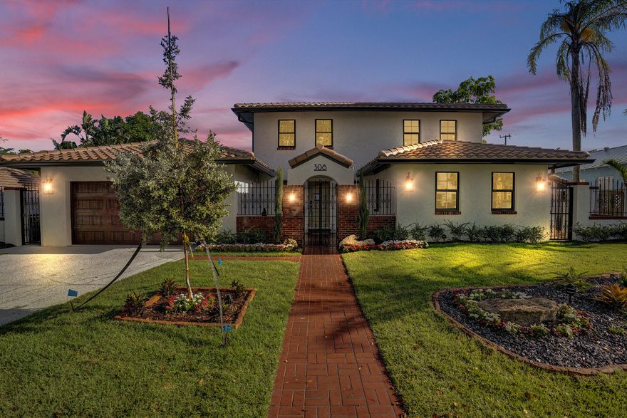 Welcome to this stunning 5-bedroom/ 4.5-bath residence located in the highly sought-after historic neighborhood of Southland Park. Thoughtfully reimagined from top to bottom, this home showcases a complete renovation including new roof, impact doors and windows, AC, plumbing, electrical, flooring, and finishes throughout. Designed to impress, the home seamlessly blends modern elegance with timeless vintage charm. Chef-inspired kitchen anchors an open-concept, perfect for entertaining, and complemented by a built-in wine cellar. Spa-like bathrooms have been beautifully renovated, and the home offers primary suites on both levels. Situated on an oversized lot, the expansive backyard is a true private oasis featuring a swimming pool and endless potential to create your dream outdoor space. Enjoy an unbeatable location just moments from the Intracoastal Waterway, scenic bike and jogging paths, waterfront parks with beach access, and pet-friendly green spaces. Ideally positioned near Downtown West Palm Beach, Palm Beach Island, Mira Lago, world-class dining, shopping, and cultural destinations including the Norton Museum of Art and Ann Norton Sculpture Gardens. With easy access to major highways, Brightline, Palm Beach International Airport, and the Palm Beach Zoo, convenience meets luxury at every turn.  Experience the best of South Florida living—no oceanfront required.