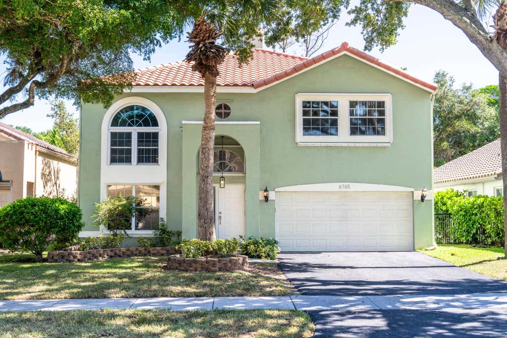 Photo of 6765 NW 75th Place, Parkland, FL 33067 (MLS # B26066219)