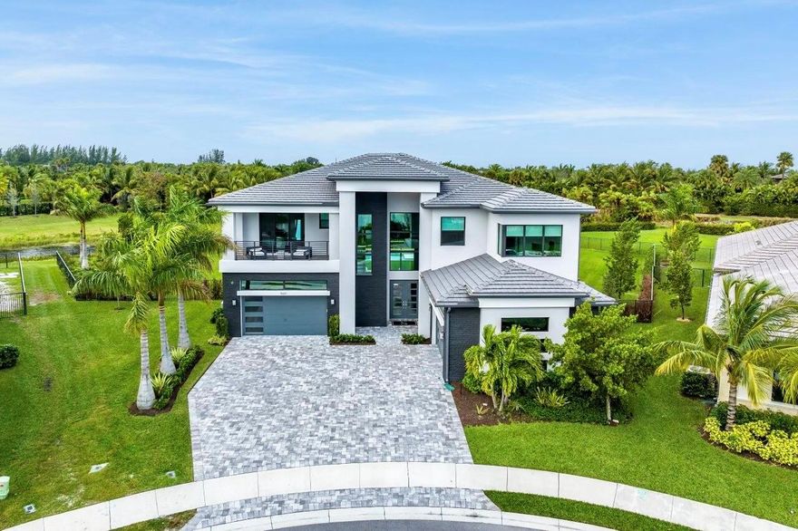 Nestled on one of the largest lots in all of Boca Bridges, (over 27,000 sq/ft!), this Contemporary Riverside residence takes outdoor living to a whole new level. The backyard is a sprawling oasis that stretches as far as the eye can see, with breathtaking views, and an unparalleled sense of space and privacy. This residence stands out as the premier lot in the esteemed Boca Bridges. The approximately 6,000 SF Riverside Premium Model captivates with its impressive architectural elements. A grand entrance leads to open-concept dining and family rooms, seamlessly connected to a remarkable kitchen featuring top-of-the-line Wolf appliances and Miele 48'' cabinet depth, side-by-side refrigerator/freezer......
