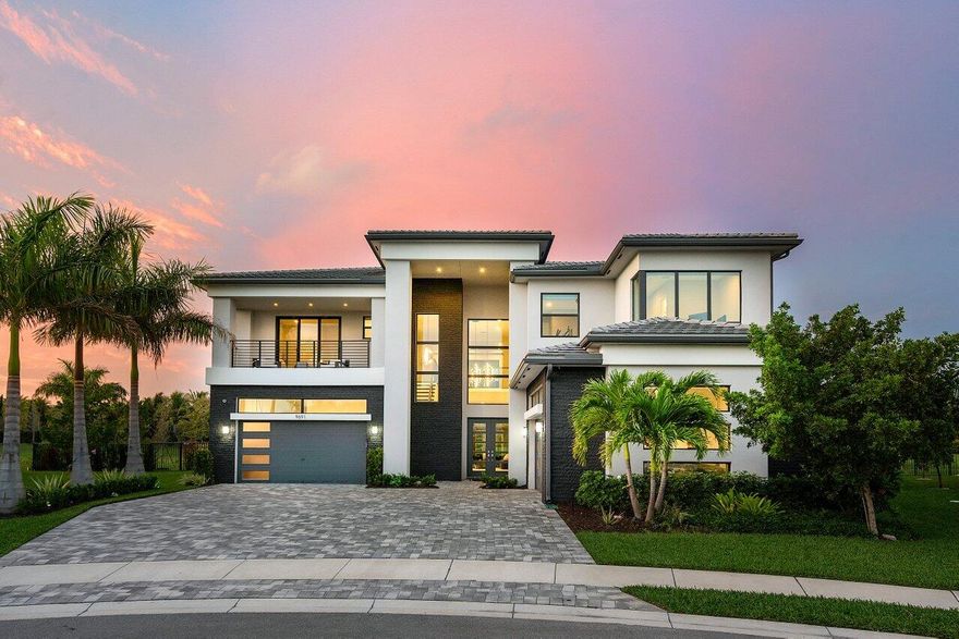 Nestled on one of the largest lots in all of Boca Bridges, (over 27,000 sq/ft!), this Contemporary Riverside residence takes outdoor living to a whole new level. The backyard is a sprawling oasis that stretches as far as the eye can see, with breathtaking views, and an unparalleled sense of space and privacy. This residence stands out as the premier lot in the esteemed Boca Bridges. The approximately 6,000 SF Riverside Premium Model captivates with its impressive architectural elements. A grand entrance leads to open-concept dining and family rooms, seamlessly connected to a remarkable kitchen featuring top-of-the-line Wolf appliances and Miele 48'' cabinet depth, side-by-side refrigerator/freezer...... Transitioning between rooms reveals tray ceilings, upgrades flooring, an abundance of lighting and custom built-ins.
 
The neutral palette and tasteful design permeate throughout, complemented by custom window treatments, and smart home features. The versatile clubroom adds to the entertainment value with a wet bar, beverage refrigerator, and custom media center. An impactful entrance with a glass staircase sets the tone as you enter the home, leading up to a purposeful loft and covered veranda for continued appreciation of the pristine view, adorned with phantom screens.
 
The luxurious primary suite boasts a spa-like bathroom retreat, featuring a multi-function shower with wall jets, TWO rain showers, and a free-standing soaking tub. High-end designer finishes, and a covered veranda complete the suite. The 4 additional ensuite bedrooms each offer unique benefits, some with flexible bonus spaces. Convenience is prioritized with an intelligently designed upper-level laundry room, ample storage, and a split four-car garage, already wired to accommodate 3 Teslas.
 
Mechanical upgrades abound, living is elevated, literally, with an elevator. The home features custom lighting, window treatments, custom audio/visual systems inside and out. Speaking of outside, the heated pool and spa are resort worthy, and the backyard must be seen to take in the enormity and privacy of the lot. Boca Bridges, the prestigious GL Homes lifestyle community, provides a secure gated entrance and a 27,000 sq/ft clubhouse with resort-style amenities, including a restaurant, lounge, fitness center, sports court, tennis and pickleball courts, pools, playground, and more. Make sure to view the video walkthrough and test drive the "dollhouse" video tool on the listing.