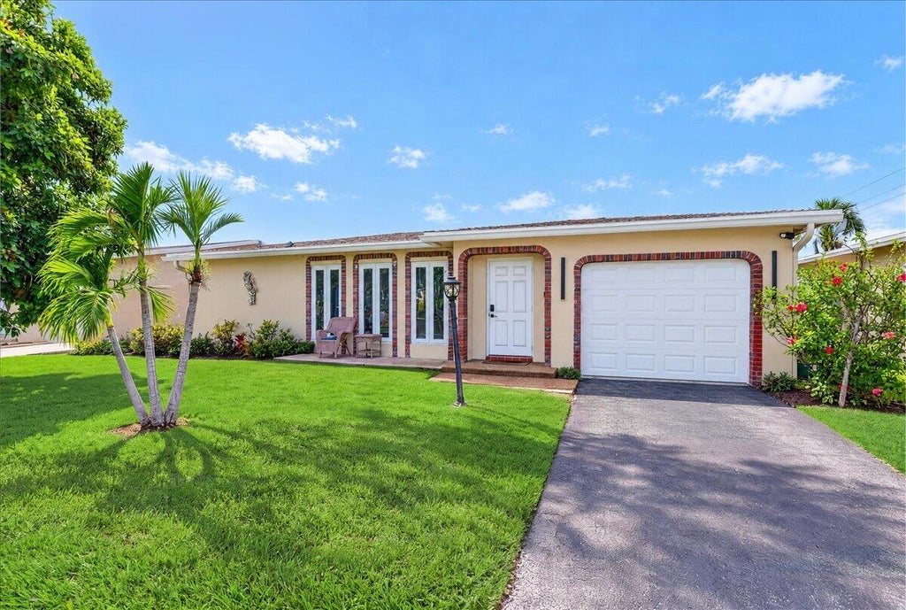 Photo of 4911 NW 14TH Ter, Deerfield Beach, FL 33064 (MLS # B26079335)
