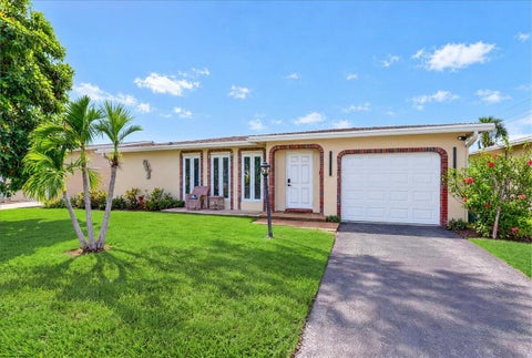 Photo of 4911 NW 14TH Ter, Deerfield Beach, FL 33064 (MLS # B26079335)