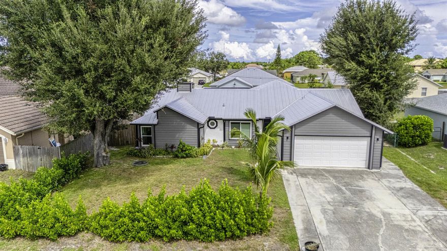 Beautiful 4-bedroom, 3-bath pool home in Port St. Lucie featuring a metal roof, hurricane impact windows, and a screened saltwater pool. The main residence offers 3 bedrooms and 2 baths for $3,200/month, with the option to include a private 1-bedroom, 1-bath mother-in-law suite and office for an additional $800/month. Pool and lawn care are included in the rent, offering hassle-free living. Flexible options make this home ideal for multi-generational living or work-from-home needs. Conveniently located near shopping, dining, and major roadways. Pets considered.