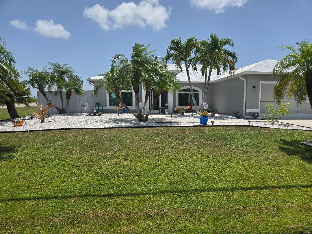 AMAZING WATERFRONT LOCATION on DOUBLE LOT with NEW SALTWATER SOLAR HEATED POOL! Fully fenced yard, with double gates on almost 1/2 acre! Observation deck to watch all the wildlife, water fowl or sunbathe. Screened lanai pool area and pool cover. 2 Driveways and new carport. Plenty of parking for RV's, Boats/Trailers & more. COMPLETE, NEW IMPACT WINDOWS, DOORS & GARAGE DOORS. Motorized screens for the patio. You just need to come see all the upgrades! Words can't even begin to do this fantastic home and outside living area justice! It is a true piece of Florida Paradise! You will say '' Honey, I'm Home''!