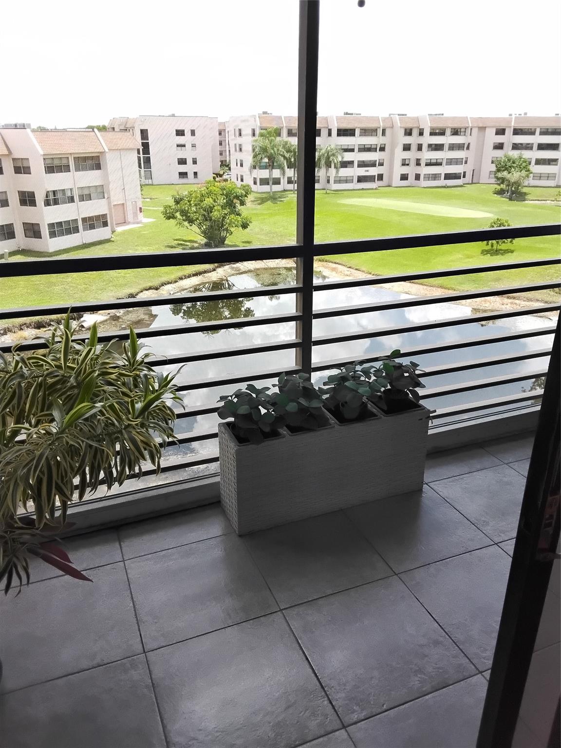 Nicely upgraded, top floor, fully tiled condo with screened balcony overlooking water and golf view. Kitchen upgrades include cabinets with pull-out drawers, SS appliances and granite counters. The bathrooms are upgraded. There is a new A/C and new washer/dryer. Building upgrades include a new roof (2024) and new elevator (2024). The building was painted and catwalk resealed in 2023. No worries for major assessments in the near future. Phase 4 offers a clubhouse with theater, ballroom for parties, fitness center, billiard room, free exercise classes and non-stop activities. There are multiple pools, golf course, tennis courts, BBQ's and much more. 55+ per condo association. Buyer must meet condo association financial requirements.