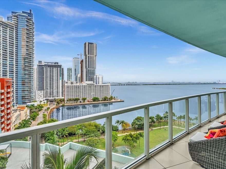 Experience the ultimate South Florida lifestyle! This stunning condo offers incredible panoramic views of Biscayne Bay & the sweeping city skyline. Wake up to breathtaking tropical sunrises from your large private balcony, accessible from both the living room & bedrooms, making every day feel like a vacation.
Inside, you'll find a beautifully updated & tastefully designed space featuring porcelain flooring, volume ceilings, electric window shades, and a sleek European kitchen w/ quartz countertops. The location w/in Quantum is one of the best, overlooking the tranquil Margaret Pace Park. For ultimate convenience, this unit features two parking spots located just steps from the elevators. Enjoy all the amazing amenities Quantum has to offer.  Art collection & designer furniture negotiable.