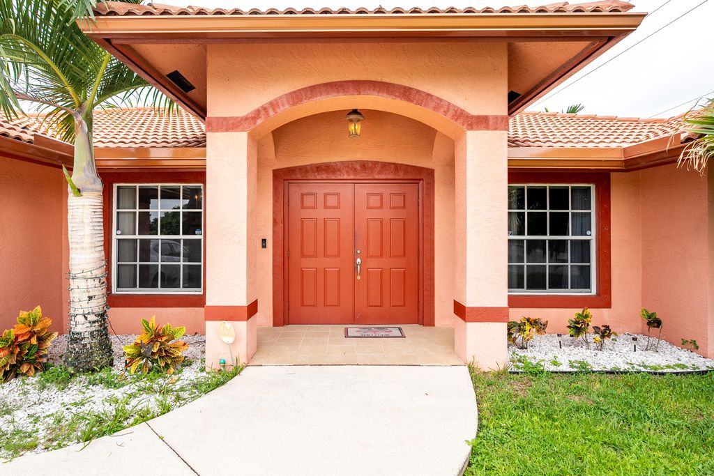 Photo of 1698 SW Mercedes Avenue, Port Saint Lucie, FL 34953 (MLS # R11087072)