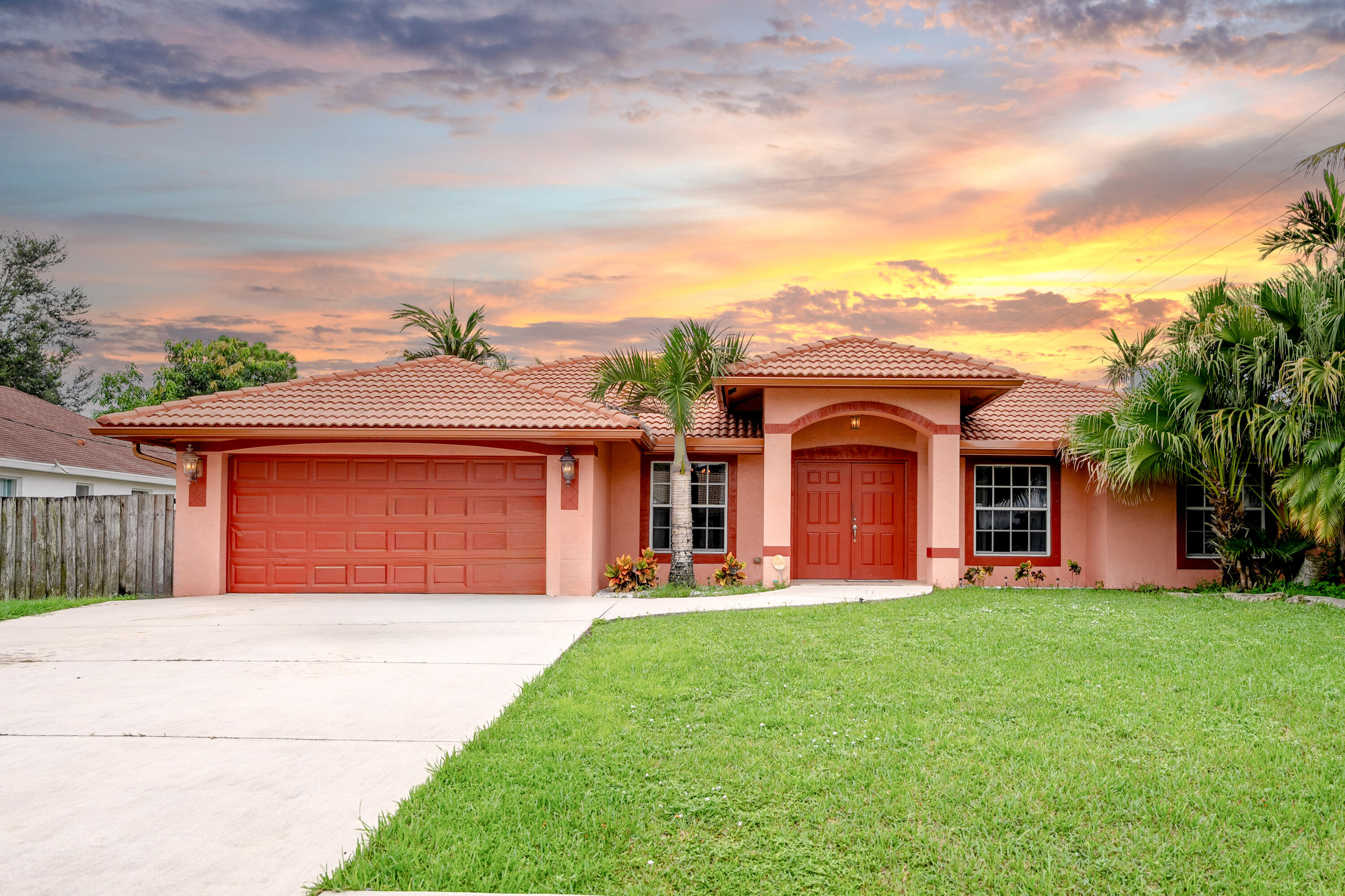 $5,000 CLOSING COST CREDIT TO BUYERS!!OVERSIZED CORNER LOT!! Large Mediterranean Style 4/3/2 CBS home with NO HOA! This award-winning floor plan includes an independent in-law suite with a private bathroom and entrance. Some of the nicest features of this home include a tiled roof, ceramic tiles throughout, granite counter tops, SS appliances, a screened covered lanai with outdoor patio, an irrigation system, gutters all around, a fenced backyard with an above-ground swimming pool surrounded by beautiful palm trees to enjoy the outdoors all year round! Great neighborhood conveniently located within walking distance to Gatlin Blvd, I-95, Banks, Walmart, and Tradition shopping areas.