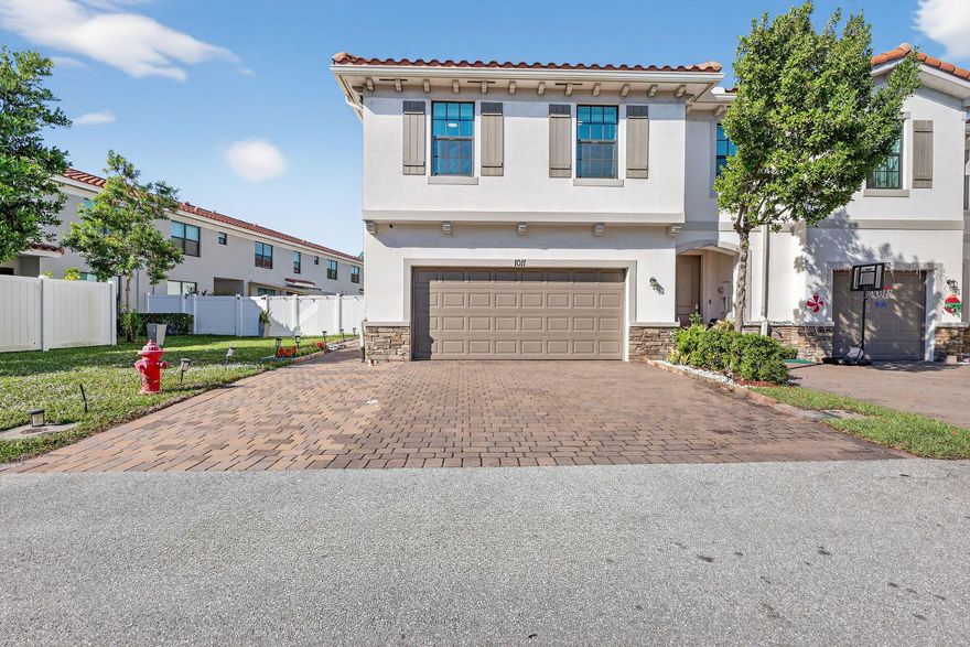 Beautiful updated 4BR/2.5BA/2car garage townhouse in Arbor Parc. Corner unit, one of the largest lots in the community. Built in 2021, totaling 1743 SQFT under AC. This move-in-ready home offers an open floor plan, high ceilings, impact windows, and a lot of natural light throughout. Tile floor throughout downstairs. The upgraded kitchen boasts quartz-style counters, stainless appliances, a large peninsula island, and food pantry. Dining and living room with LED lighting, impact slider door access to a large fully fenced in back patio with paver stones, perfect for gathering and entertaining. Upstairs, luxury vinyl floor though out, the spacious primary suite includes dual vanities and a glass-enclosed shower. and a convenient second floor laundry room nearby.