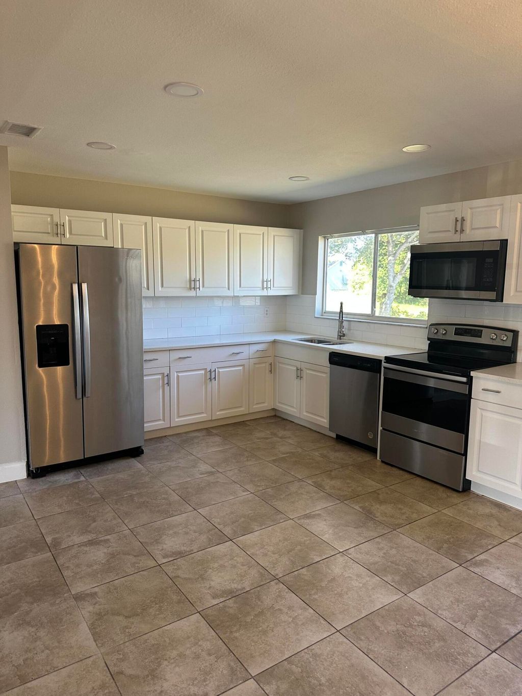 Photo of 377 SW Cherryhill Road, Port Saint Lucie, FL 34953 (MLS # R11152951)