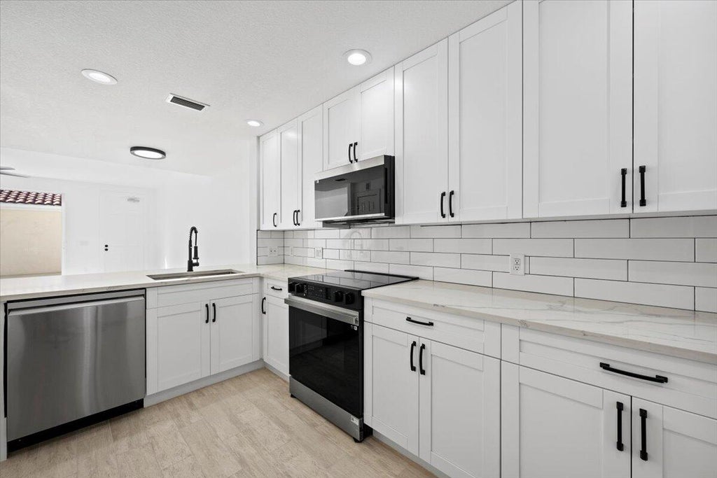 Photo of 136 Soriano Drive, Jupiter, FL 33458 (MLS # R11066680)