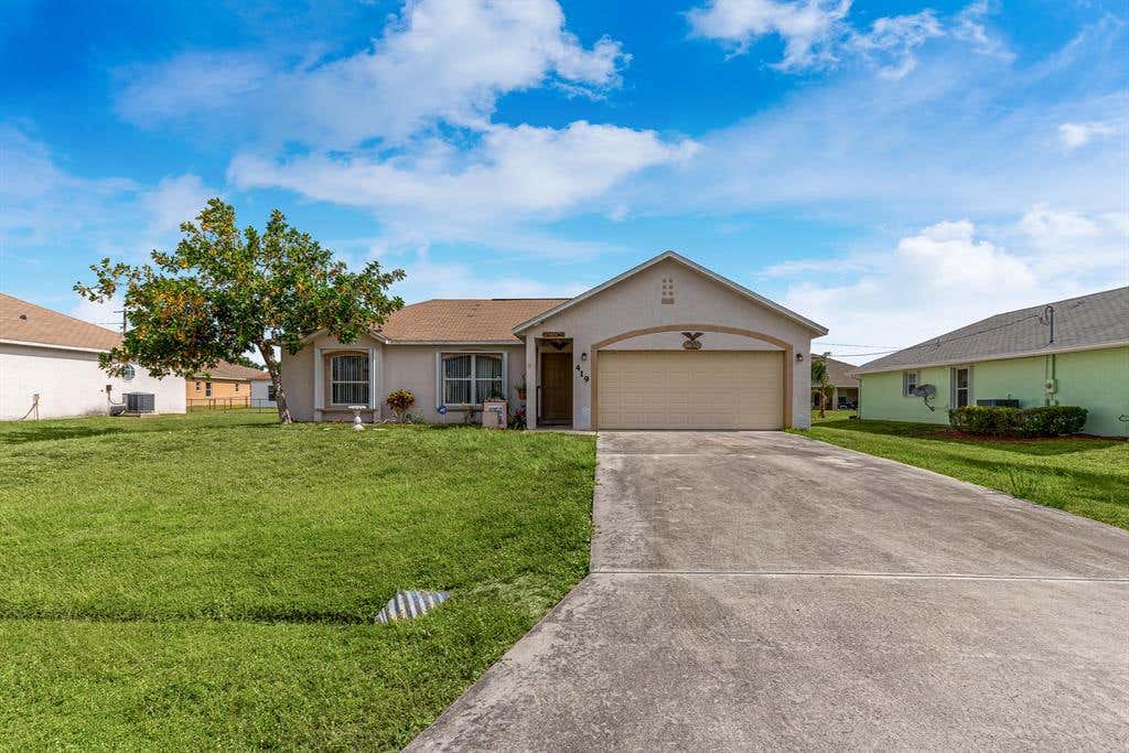 Photo of 419 SW Exmore Avenue, Port Saint Lucie, FL 34953 (MLS # R10716960)