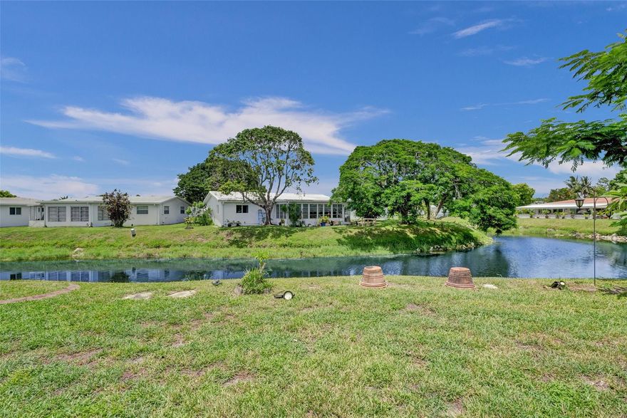 ***LARGE, PIE-SHAPED, WATERFRONT LOT.*** Retirement is easy in this MOVE IN READY 2-BR home featuring NEWER WATERPROOF WOOD FLOORS; FRESHLY PAINTED INTERIOR; UPDATED BATHROOM; An UPDATED MODERN KITCHEN with WHITE SHAKER CABINETS paired with QUARTZ COUNTERTOPS & ALL MATCHING STAINLESS KITCHEN APPLIANCES. Enjoy PEACEFUL WATER VIEWS from KITCHEN, MAIN LIVING AREA, MASTER BEDROOM & ENCLOSED FLORIDA ROOM with windows. SOLAR PANEL installed recently and Seller's electric bill is under $100. ** 2023 RHEEM WATER HEATER & 2020 RHEEM AC. **
An Active 55+ Community with lots to do. LOW HOA Fee covers grass cutting, repainting exterior of homes every few years and amenities. PRICED TO SELL !