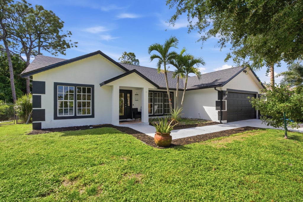 Photo of 1206 SW Emerald Avenue, Port Saint Lucie, FL 34953 (MLS # B26091530)