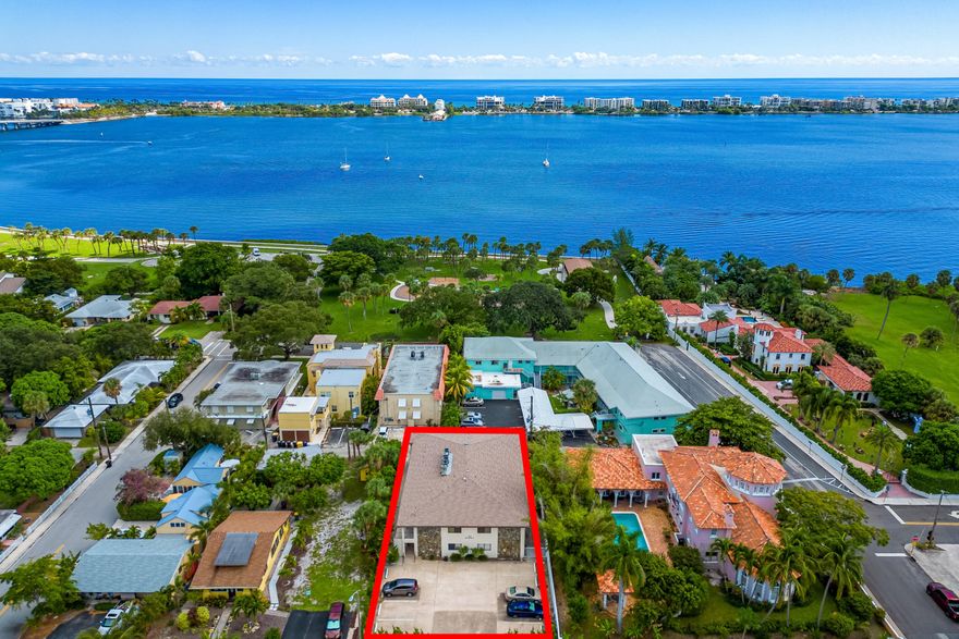 WALK TO THE BEACH! NO SPECIAL ASSESSMENTS, LOW HOA. Rare opportunity to own a fully remodeled 2BR/2BA coastal residence in an intimate boutique CBS building with only 6 total units, located on one of the area's most vibrant and desirable streets, less than a block from the Intracoastal and just minutes to the beach, downtown Lake Worth Beach, top restaurants, shops, nightlife, and waterfront dining.  This spacious end-unit condo offers extra privacy, additional natural light, extra storage, views overlooking the iconic pink mansion, and a private screened patio perfect for enjoying the coastal breeze. Inside, the home features a large open floor plan with a desirable split dual-primary bedroom layout, ideal for privacy, guests, seasonal living, or rental flexibility. The meticulously maintained interior showcases high-end kitchen upgrades, modern finishes, and thoughtful renovations throughout.  Investors and seasonal owners will love the ability to rent immediately and up to 4 times per year, offering excellent flexibility and income potential. The property is currently rented annually, unfurnished, at $2,400/month providing immediate revenue from day one. Whether you are looking for a full-time residence, vacation retreat, or income-producing property, this condo offers the perfect blend of lifestyle, charm, walkability, and long-term value in one of South Florida's most sought-after coastal communities. Boutique buildings with this level of location, flexibility, and style rarely become available.