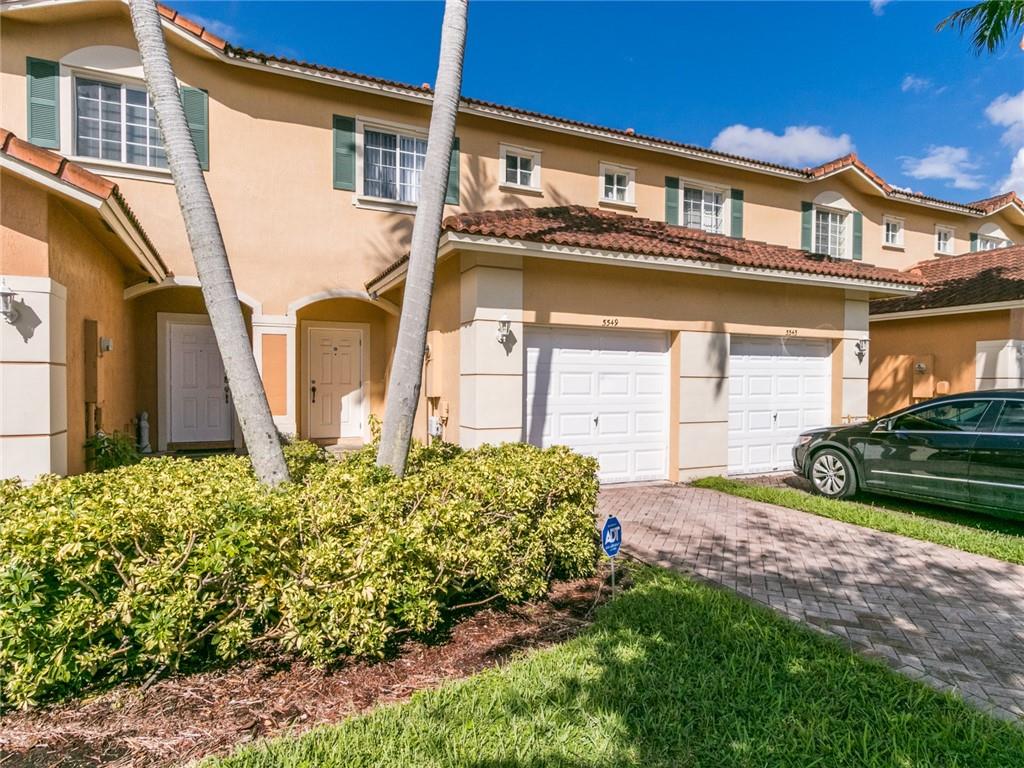Fabulous townhouse with one car garage! Come see the gated community of Monte Carlo. This unit has all bedrooms and two baths upstairs and half bath downstairs. Third bedroom is a loft/den with no door. Foyer entry with open plan kitchen with pantry, living room sliders leading to back patio and private grassed area. Brand new vinyl flooring downstairs, brand new washer/dryer and new stainless kitchen appliances just installed. Great location! 2 cars allowed, plus spaces for guests, Cmmty pool and tot lot, roving security patrol too! A must see for this price! Great owner seeking great tenants!