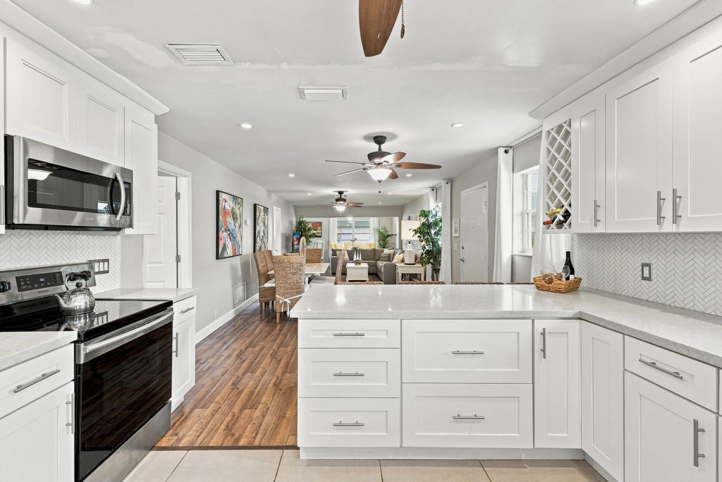 Photo of 435 BLUEBIRD Lane, Delray Beach, FL 33445 (MLS # B26071760)