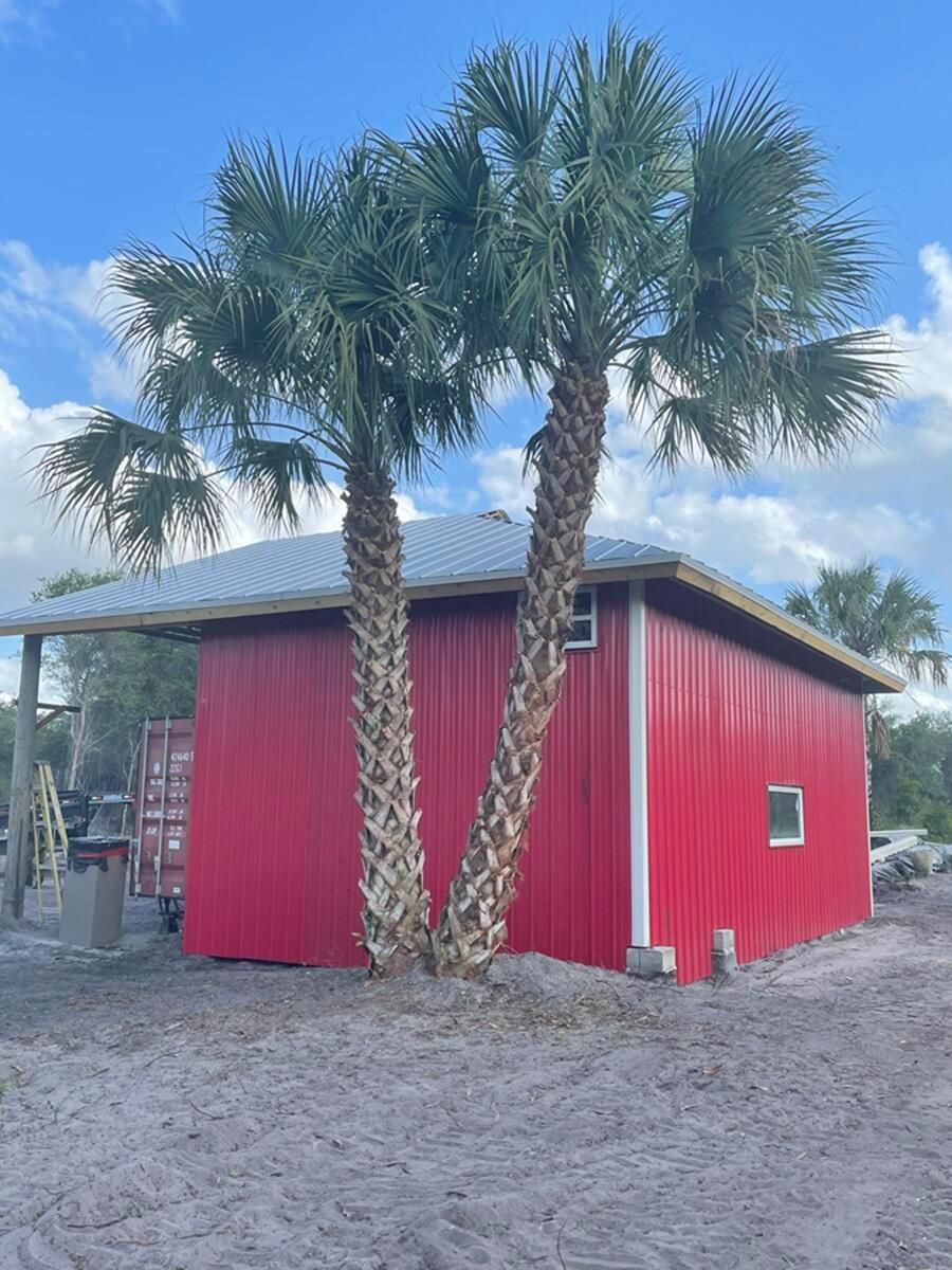 11 acres in western Martin County with barn. Land is well drained, not in a flood zone, no wetlands on the property and no HOA. Very private with entry gate, fenced with many mature oaks. Zoning allows for livestock, nursery production. 2 separate homes or barndo-miniums can be built on this property.
