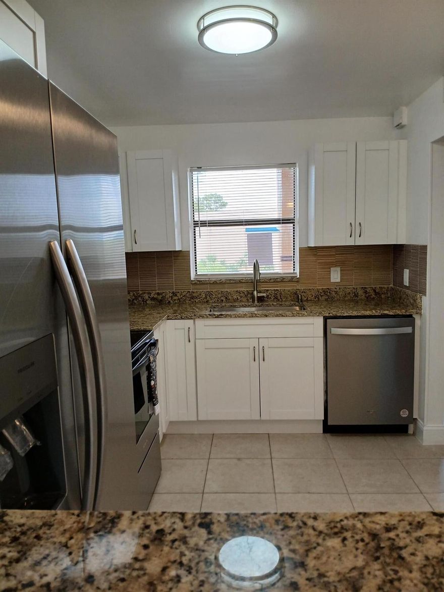 Water and Cable included in rent.  Brand New renovated kitchen, new granite, all new tile floors throughout, Full bathroom has brand new shower and vanity with granite top, guest bathroom has brand new vanity with quartz top, both bathrooms have brand new Kohler comfort height toilets, all brand new stainless steel appliances include dishwasher, flat top stove with microwave above, side by side fridge with icemaker in door, walk in closet in bedroom plus 2nd closet, screened in porch, top floor, end unit, elevator.