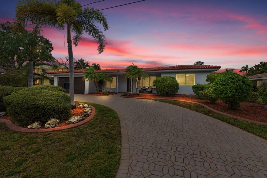 Experience Elevated Waterfront Living in Lighthouse Point. This Impeccably Updated Home with Key West & Mediterranean vibes boasts Ocean Access, Private Dock & 1 fixed bridge. One of LHP's highest Elevation Lots. New Roof 2023, Concrete Piling Construction, offers Peace of Mind & Timeless Elegance. There's 6 Fruit Trees, Mango, Banana & Soursop. Inside, enjoy a Designer Kitchen 2023, Both Bathrooms 2023, HVAC & Electric Updated 2020, Water Heater Updated 2018, Porcelain 3' x 3' Tile Flooring. Full Hurricane Protection with New Impact Windows, Doors & Shutters. Pool, Updated Pool Pump & Sprinkler System, Fenced Yard, 2 Car Garage & Circular Driveway to park up to 7 Cars Complete this Coastal Gem. Minutes from Beaches, Dining, Shopping, Top Rated Schools, Luxury, Location, & Lifestyle await. Buyers and Buyers Agent to verify all information and measurements.