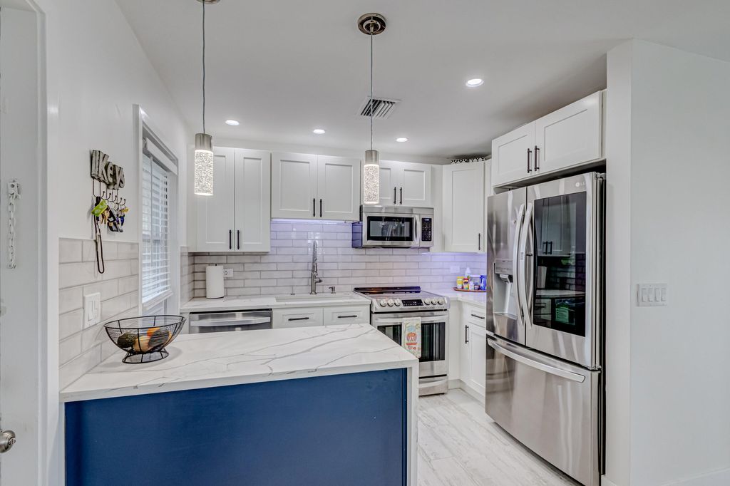 Photo of 813 Hummingbird Way #6a, North Palm Beach, FL 33408 (MLS # R10948861)