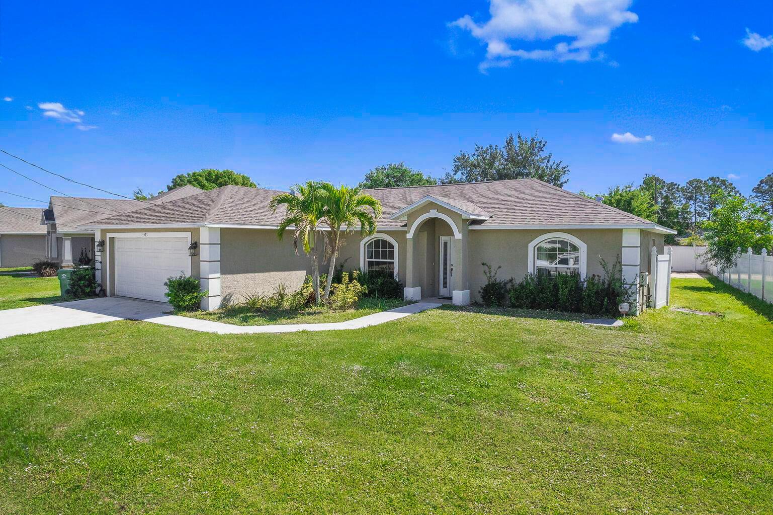 Well-maintained 3-bedroom, 2-bathroom, 2-car garage home built in 2016, located in the Torino area of Port St. Lucie. This move-in ready property features a new roof installed in 2023, an open floor plan, and a modern kitchen with granite countertops, stainless steel appliances, and white cabinetry. The main living area features wood flooring throughout, and the living room opens to a screened-in lanai, offering a comfortable space for indoor-outdoor enjoyment. The primary suite includes a dual-sink vanity, walk-in shower, and generous storage. The home sits on a spacious lot with a fully fenced backyard, outdoor storage shed, and a concrete pad with potential for outdoor use or future projects. Conveniently located near I-95, parks, schools, and shopping. No HOA.