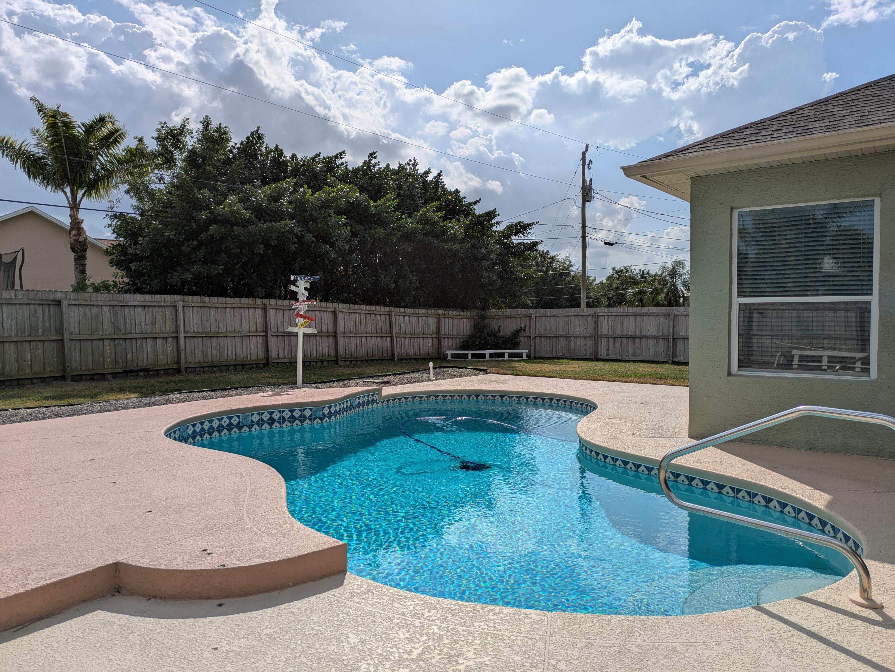 REDUCED!!! Spacious 4-bedroom 2 bath pool home has space for everyone. Large corner lot. Formal living and dining areas plus breakfast and family rooms. All tile living areas w/ laminate flooring in all bedrooms. Split bedrooms for privacy. Updated guest bath. Double shower in updated primary bath. This one's a commuters dream with easy access to both FL Tpk and I95. Located in a quiet neighborhood, but just minutes to shopping and restaurants. Newer roof 2021, A/C 2019, water heater 2022. Privacy fenced yard with salt chlorinator inground pool. Florida living at its best! Ring doorbell and nest thermostat included. Washer/dryer & garage fridge negotiable.
