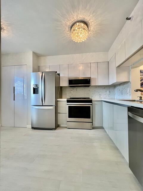 Photo of 6866 Huntington Lane #306, Delray Beach, FL 33446 (MLS # B26080123)