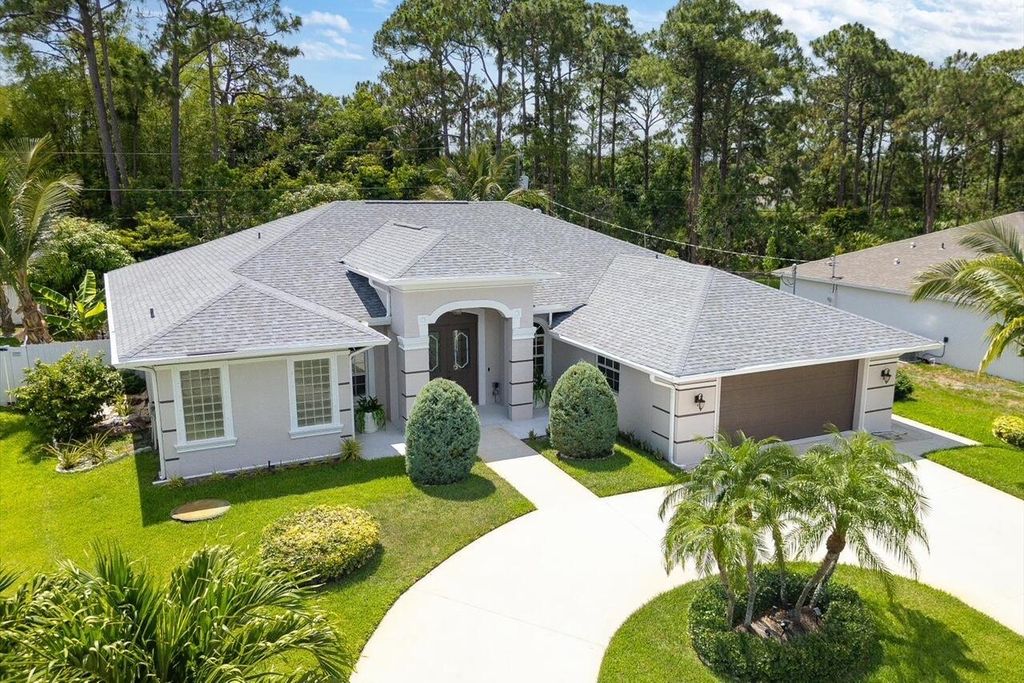 Photo of 3234 SW Nutley Street, Port St Lucie, FL 34953 (MLS # R11092995)