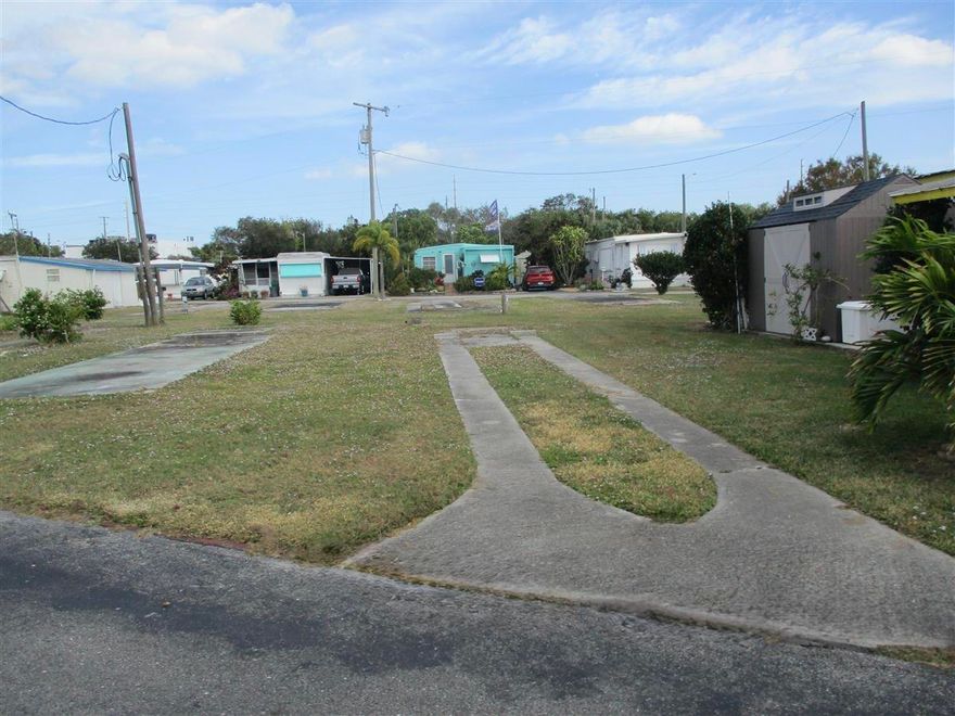 55 + CO-OP Community, Whispering Creek. Vacant Lot...Ready for Your Mobile Home or Tiny Home! That's right...TINY HOME APPROVED! This cleared and ready-to-go lot is nestled in a welcoming CO-OP community where you OWN a share in the park, not a land lease! Unbelievably low HOA...just $255 a month! The lot comes with power and water hookups, so bring your vision and settle into affordable Florida living with ease. Whether you're dreaming of a cozy mobile home or a trendy tiny home escape, this is your blank canvas in a peaceful, community-oriented setting.
