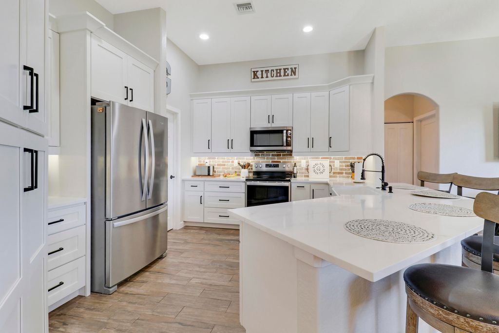 Photo of 1338 SW Hebner Avenue, Port Saint Lucie, FL 34953 (MLS # R11040911)