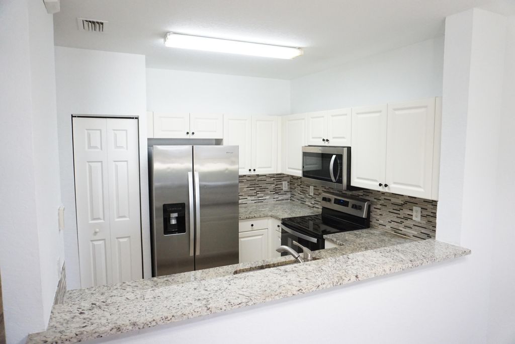 Photo of 1946 Gardenia Court, Riviera Beach, FL 33404 (MLS # B26006167)