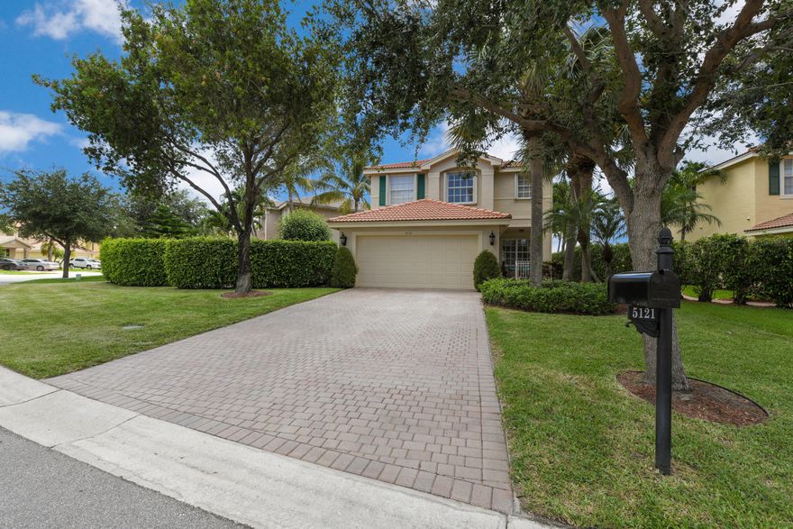 Gorgeous home in gated community of Nautica Isles with lakefront views! Come inside and be wowed by spacious living areas and gorgeous flooring throughout along with an inviting kitchen with newer stainless steel appliances. The bedrooms are spacious as well. Each room features custom closets including the garage. Outside you will enjoy a lovely, paver patio which overlooks the expansive backyard with professional landscaping. This home also features accordion shutters throughout. Live the resort lifestyle in Nautica Isles! This well-maintained subdivision is gated and offers its residents a resort style recreational facility which includes a pool, tennis and much more. Nautica Isles is conveniently located just minutes from I-95, the Turnpike, Wellington, Boynton Beach, Downtown West Palm Beach, fine shopping and dining, gorgeous area beaches and Palm Beach Int. Airport.