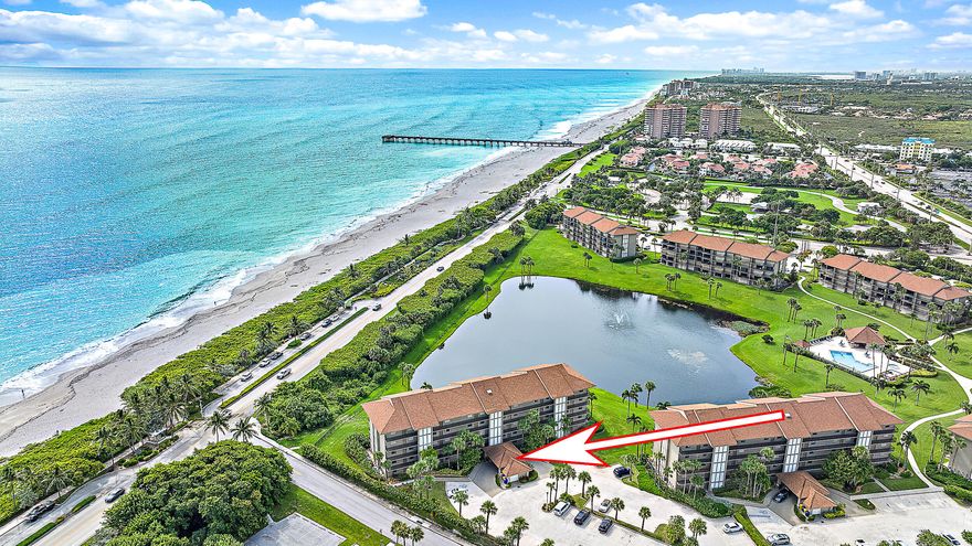 This first-floor gem offers a rare opportunity to live in a gated beach side community close to direct beach access. Skip the elevators & enjoy the convenience & ease of first floor living with direct access to indoor/outdoor spaces where you will find a beautiful, manicured lawn, swaying palm trees & lakefront views from your private patio, where the soothing sounds of the ocean provide a serene backdrop to your everyday life. Enjoy open living space w/ an updated kitchen, baths, & laundry room. Off the laundry room is a large storage area that has been transformed to a bonus room which could be used as an extra guest sleeping space or an office. Close to the pristine beaches of Jupiter w/ views of the Juno Pier make this a prime location. Jupiter offers plenty of world class dining & entertainment & located just 30 mins from the PBI Airport & famous hotspot, Palm Beach. Hurry this opportunity to own a slice of paradise won't last long!